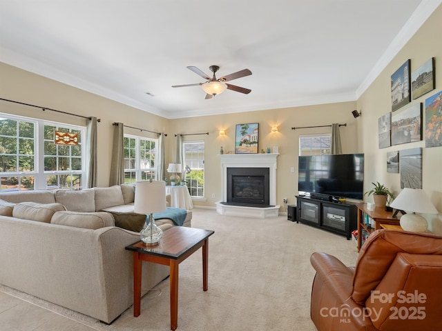 7627 Woodcrest Dr, Stanley, NC 28164 - living room with a glass covered fireplace, crown molding, a ceiling fan, light colored carpet, and baseboards