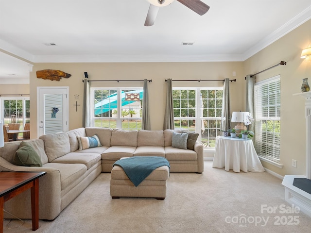 7627 Woodcrest Dr, Stanley, NC 28164 - carpeted living area with ornamental molding and ceiling fan