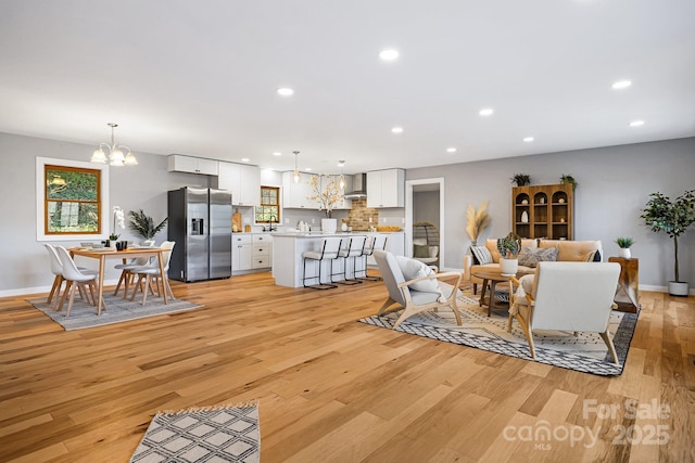 32 Whitaker View Rd, Fairview, NC 28730 - living area with a chandelier, light wood-style floors, recessed lighting, and baseboards
