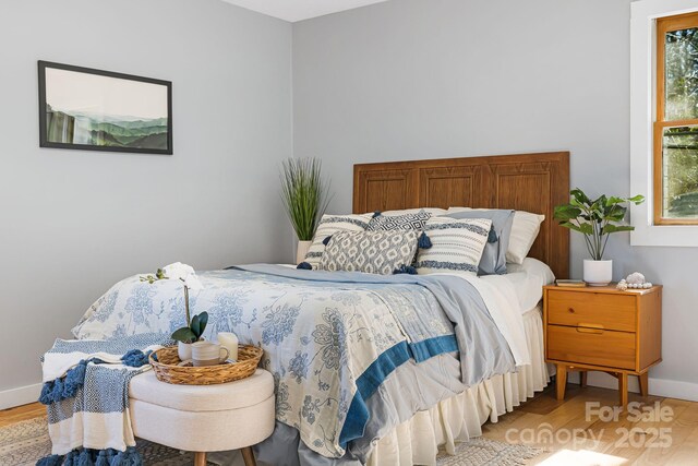 32 Whitaker View Rd, Fairview, NC 28730 - bedroom with light wood-style flooring and baseboards