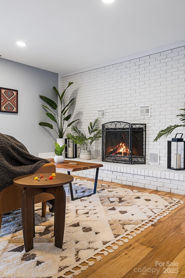 32 Whitaker View Rd, Fairview, NC 28730 - home office with a brick fireplace, wood finished floors, and brick wall