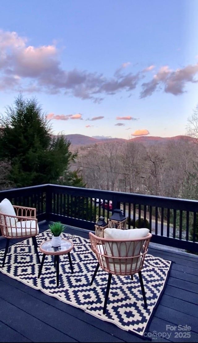 32 Whitaker View Rd, Fairview, NC 28730 - deck at dusk featuring a mountain view