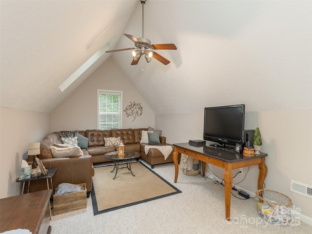 carpeted living room featuring ceiling fan and lofted ceiling