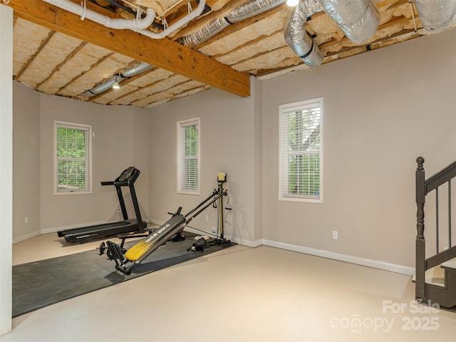 workout area featuring plenty of natural light and baseboards