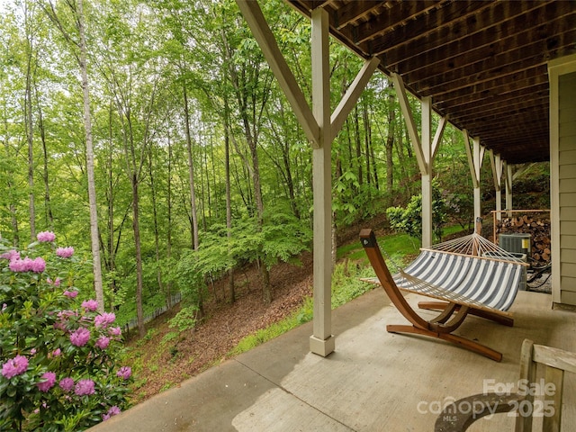 view of patio with a wooded view