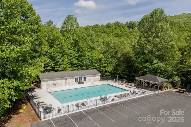 417 Blue Mist Way, Arden, NC 28704 - community pool with fence, a forest view, and a patio area