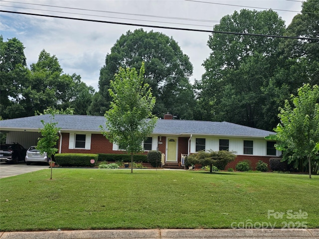 6003 Woodbridge Rd, Charlotte, NC 28227 - ranch-style house with brick siding, an attached carport, driveway, and a front yard