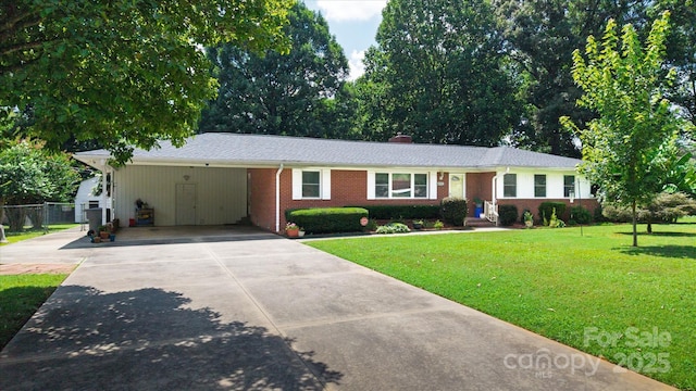 6003 Woodbridge Rd, Charlotte, NC 28227 - ranch-style home with a carport, driveway, brick siding, and a chimney