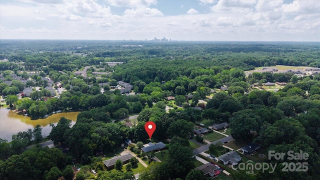 6003 Woodbridge Rd, Charlotte, NC 28227 - drone / aerial view of a large body of water and a heavily wooded area