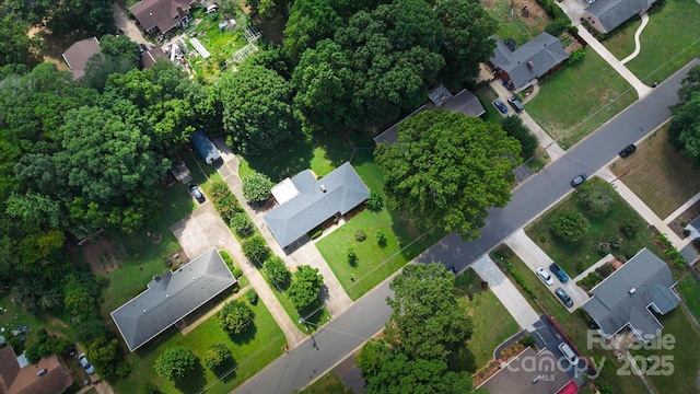 6003 Woodbridge Rd, Charlotte, NC 28227 - aerial view of property and surrounding area featuring property boundaries highlighted and nearby suburban area