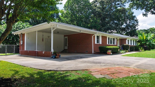 6003 Woodbridge Rd, Charlotte, NC 28227 - ranch-style house featuring an attached carport, concrete driveway, and brick siding