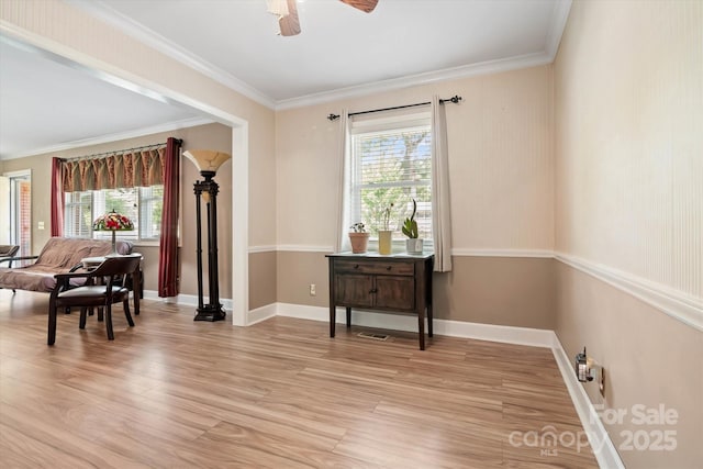 6003 Woodbridge Rd, Charlotte, NC 28227 - sitting room featuring plenty of natural light, light wood-style flooring, ceiling fan, and crown molding