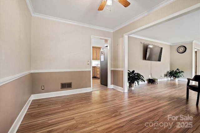 6003 Woodbridge Rd, Charlotte, NC 28227 - living area with ceiling fan, light wood-type flooring, and ornamental molding
