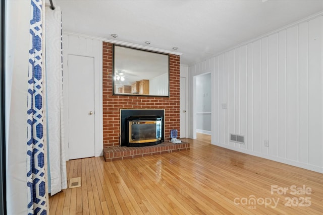 6003 Woodbridge Rd, Charlotte, NC 28227 - unfurnished living room with wood-type flooring and a fireplace