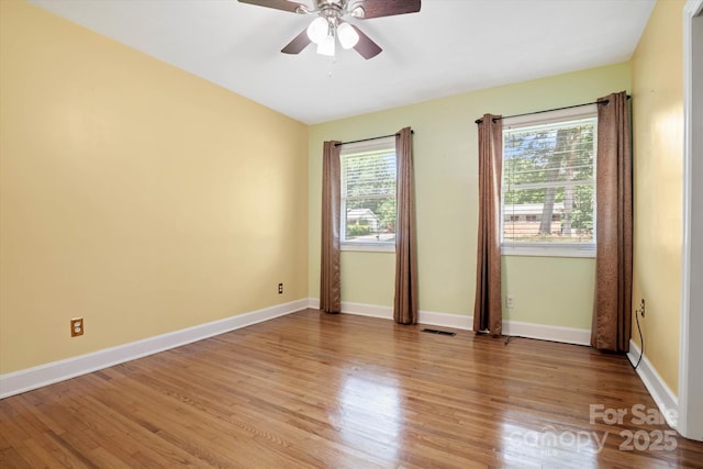 6003 Woodbridge Rd, Charlotte, NC 28227 - unfurnished room with healthy amount of natural light, a ceiling fan, and light wood-style floors