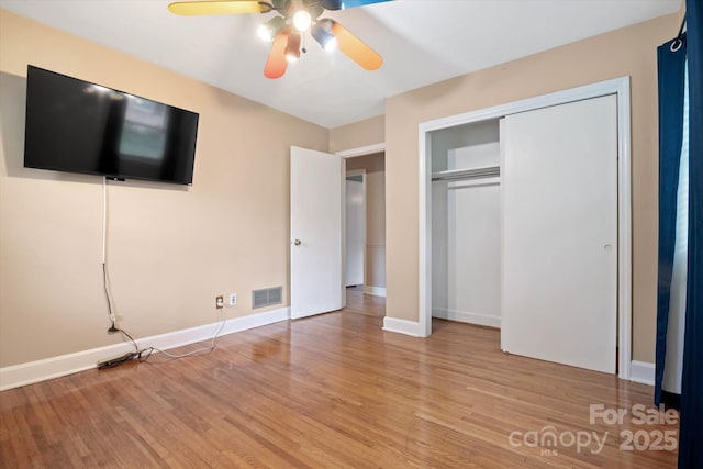 6003 Woodbridge Rd, Charlotte, NC 28227 - unfurnished bedroom featuring light wood finished floors, a closet, and ceiling fan