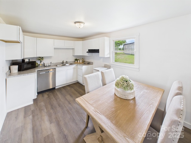 120 Hepler Rd, Taylorsville, NC 28681 - kitchen featuring stainless steel dishwasher, black microwave, a sink, under cabinet range hood, and wood finished floors