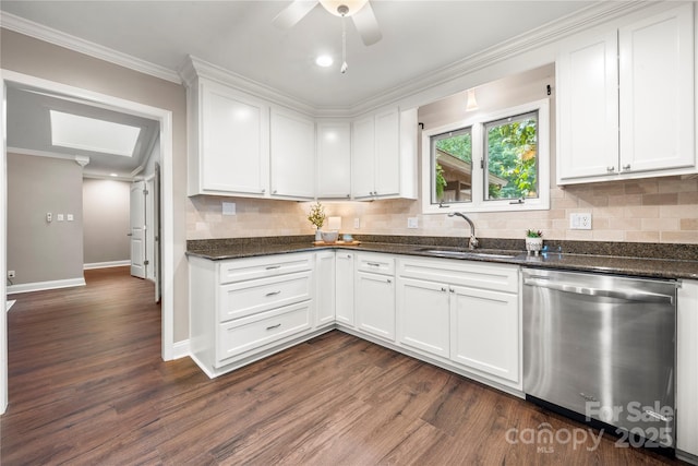 kitchen featuring stainless steel dishwasher, a sink, dark wood-style flooring, decorative backsplash, and crown molding