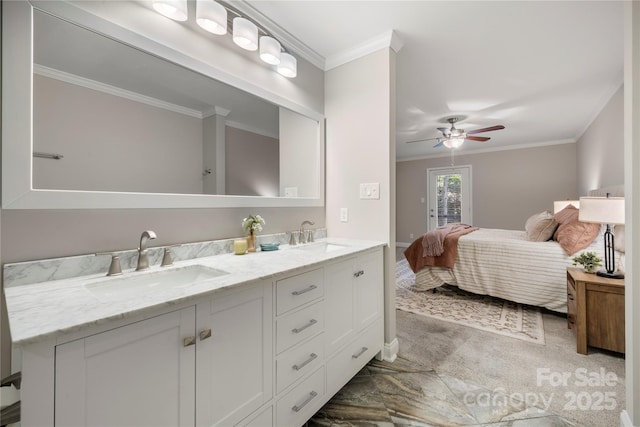bathroom with ornamental molding, ceiling fan, connected bathroom, and double vanity