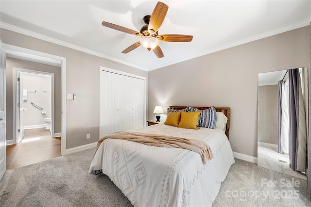 bedroom with light colored carpet, a closet, baseboards, crown molding, and a ceiling fan