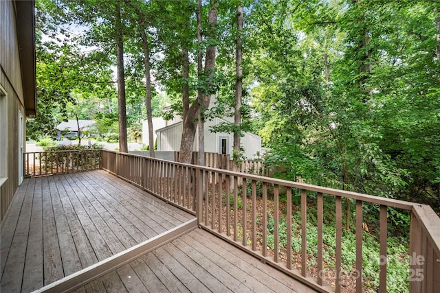 wooden terrace featuring fence