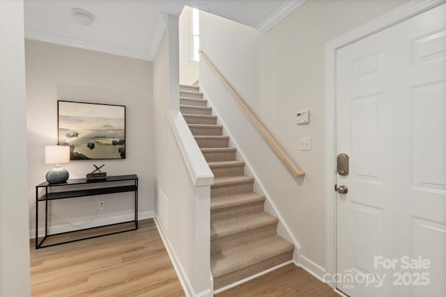 601 Carver Pond Ln, Waxhaw, NC 28173 - staircase featuring crown molding, wood finished floors, and baseboards