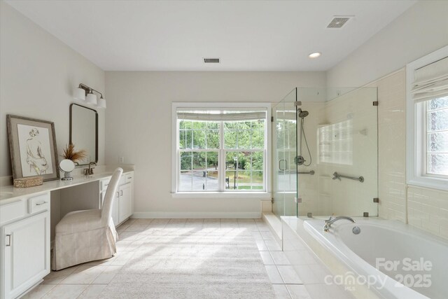 601 Carver Pond Ln, Waxhaw, NC 28173 - bathroom with tile patterned floors, a stall shower, vanity, and a bath