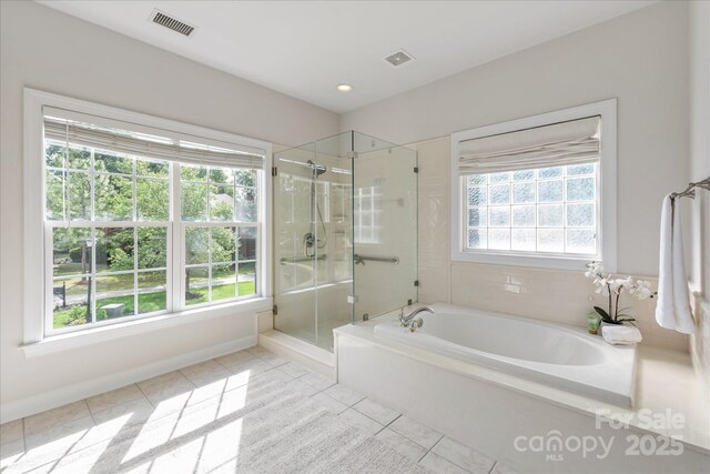 601 Carver Pond Ln, Waxhaw, NC 28173 - full bath with a shower stall, tile patterned flooring, a garden tub, and baseboards