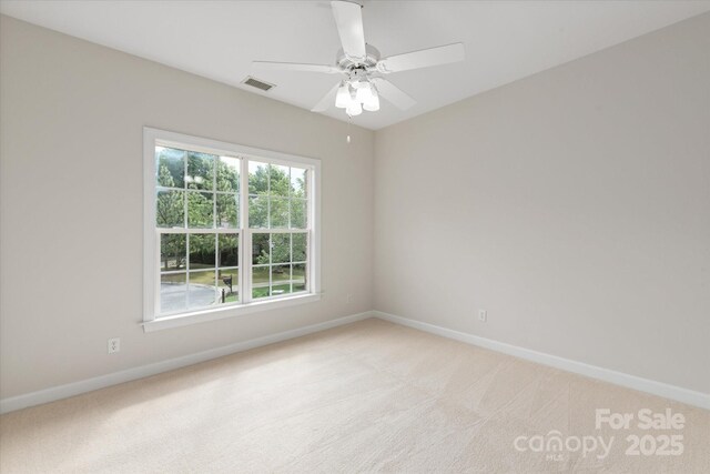 601 Carver Pond Ln, Waxhaw, NC 28173 - spare room featuring baseboards, light carpet, and a ceiling fan