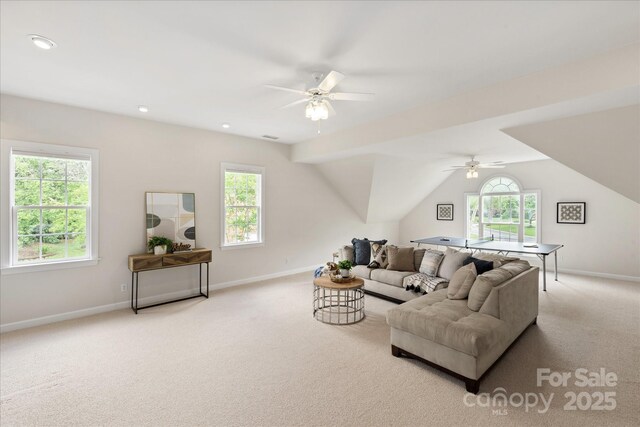 601 Carver Pond Ln, Waxhaw, NC 28173 - carpeted living room featuring a ceiling fan, baseboards, and lofted ceiling