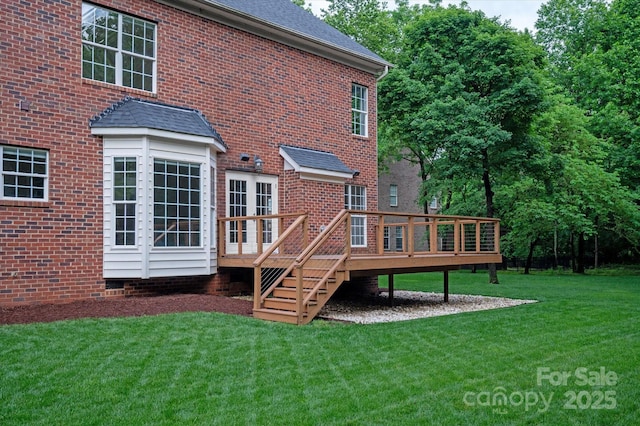 601 Carver Pond Ln, Waxhaw, NC 28173 - back of property featuring a lawn, a wooden deck, brick siding, and roof with shingles