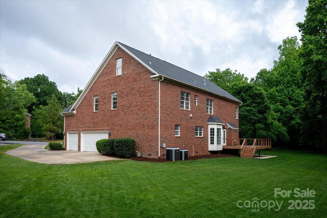 601 Carver Pond Ln, Waxhaw, NC 28173 - view of property exterior with a garage, brick siding, a lawn, and a deck
