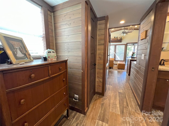 150 Easy St, Hot Springs, NC 28743 - corridor featuring light wood-type flooring, wooden walls, and recessed lighting