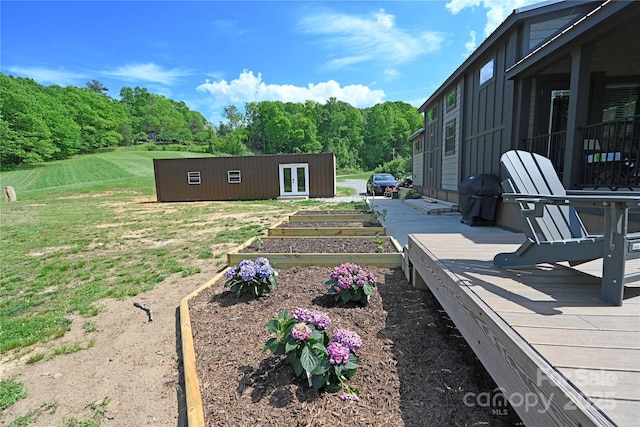 150 Easy St, Hot Springs, NC 28743 - view of yard featuring a vegetable garden, french doors, and an outdoor structure