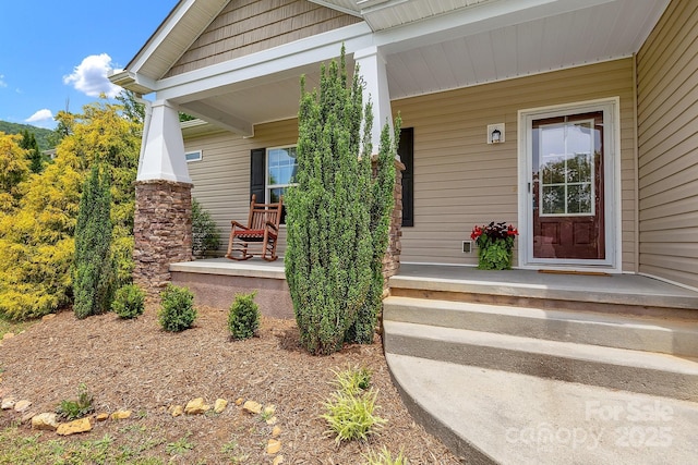 property entrance featuring covered porch
