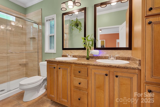 full bath with toilet, ornamental molding, a stall shower, decorative backsplash, and double vanity