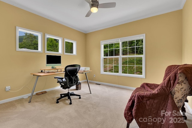 office area featuring baseboards, carpet flooring, ornamental molding, and ceiling fan