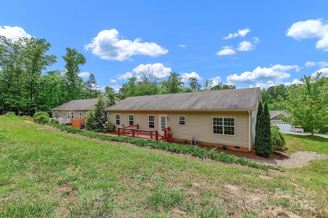 view of front of property with a deck, crawl space, and a front yard