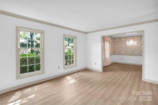 4738 Truscott Rd, Charlotte, NC 28226 - unfurnished room featuring a chandelier, plenty of natural light, light wood-type flooring, baseboards, and crown molding