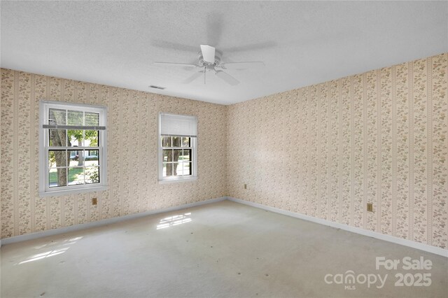 4738 Truscott Rd, Charlotte, NC 28226 - carpeted spare room with ceiling fan, wallpapered walls, and baseboards