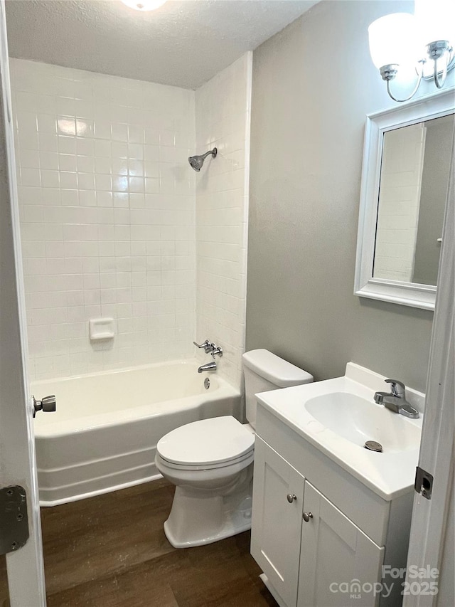 1052 S Grove Street Ext, Lincolnton, NC 28092 - full bath with wood finished floors, toilet, vanity, and  shower combination