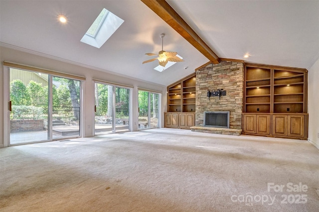 46 Timberidge Dr, Lake Wylie, SC 29710 - unfurnished living room featuring carpet, a skylight, built in features, and a fireplace