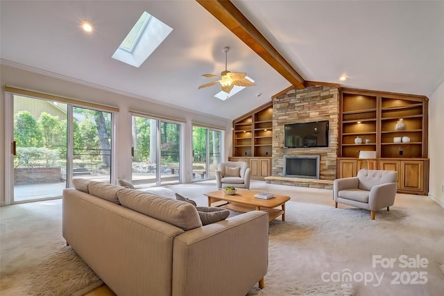 46 Timberidge Dr, Lake Wylie, SC 29710 - living room featuring light carpet, a skylight, built in shelves, and a fireplace