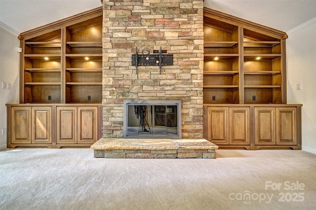 46 Timberidge Dr, Lake Wylie, SC 29710 - unfurnished living room featuring ornamental molding, carpet floors, built in features, baseboards, and a fireplace