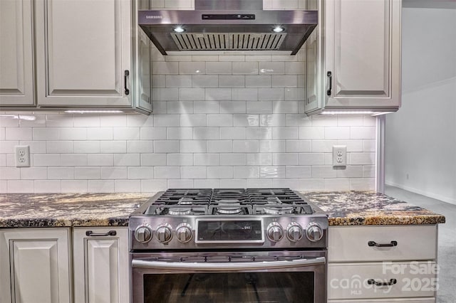 46 Timberidge Dr, Lake Wylie, SC 29710 - kitchen featuring stainless steel gas range, wall chimney exhaust hood, backsplash, and dark stone counters