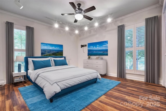46 Timberidge Dr, Lake Wylie, SC 29710 - bedroom featuring rail lighting, ornamental molding, wood finished floors, and ceiling fan