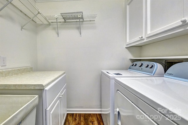 46 Timberidge Dr, Lake Wylie, SC 29710 - washroom with washing machine and clothes dryer, cabinet space, dark wood-style flooring, and baseboards
