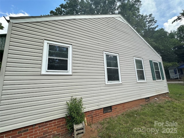 view of side of home with crawl space