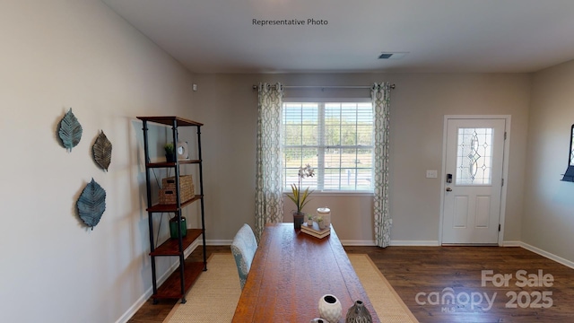 home office featuring wood finished floors and baseboards