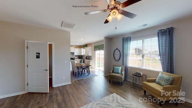 sitting room with dark wood-type flooring, a ceiling fan, baseboards, and recessed lighting